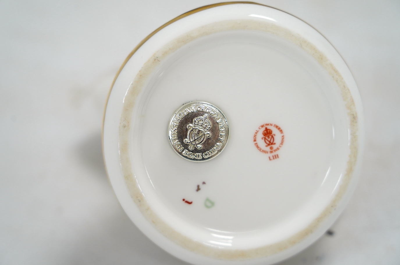 Eight Royal Crown Derby porcelain paperweights in the form of animals including a penguin, rabbit and seal, largest 17cm wide. Condition - seven good, one broken